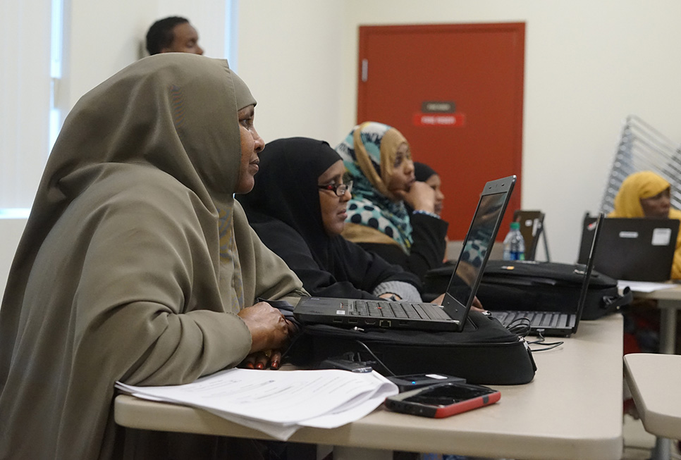 Patrons learning computer skills at our digital equity class at the NewHolly branch