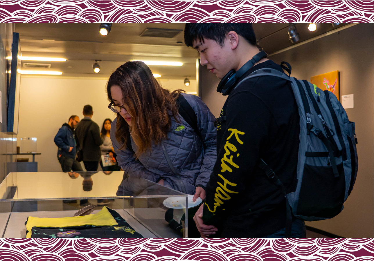 Patrons visiting an exhibit on the Level 8 gallery space at Central Library