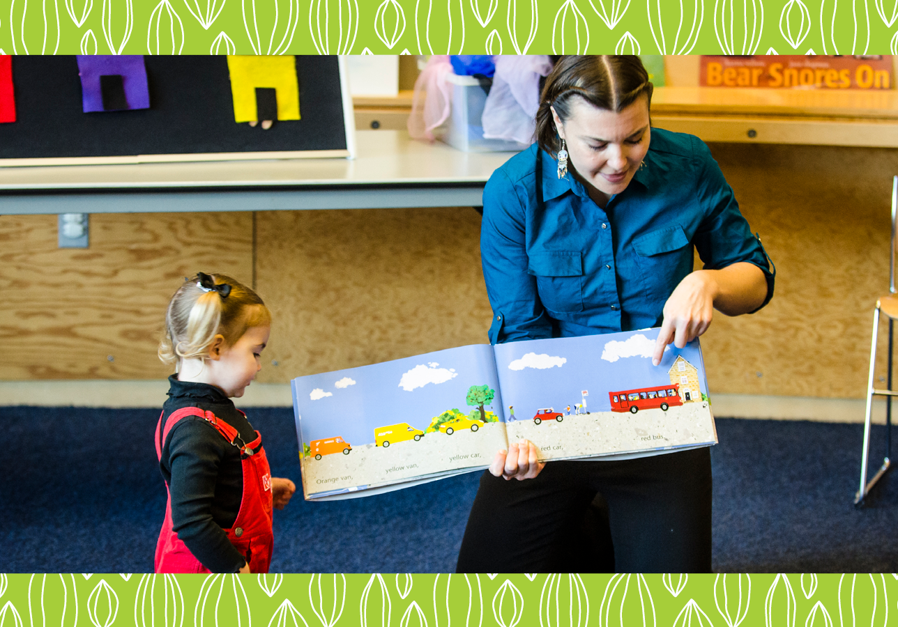 Librarian reading to young patrons at a story time event