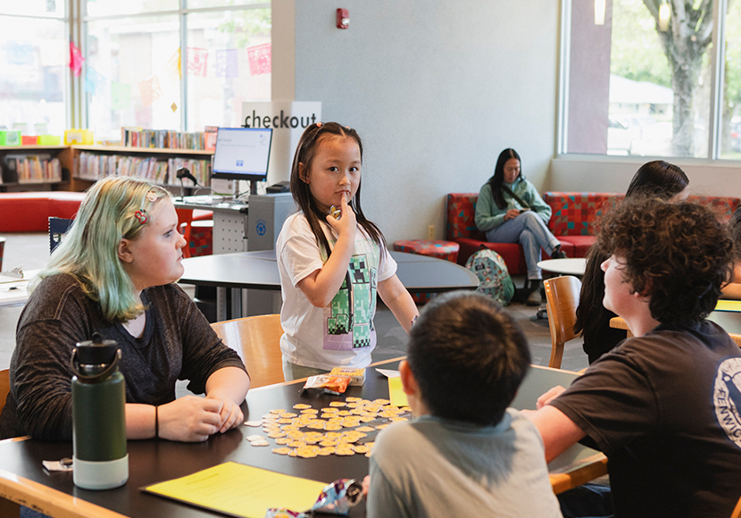 Patrons at a table in the South Park Branch.
