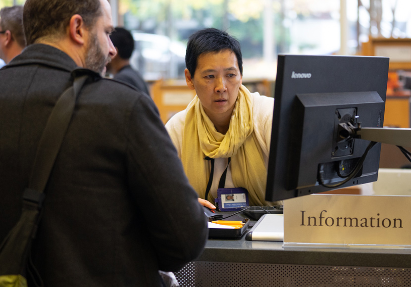 Librarian working with patron