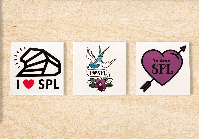 Three sample tattoos on paper backing