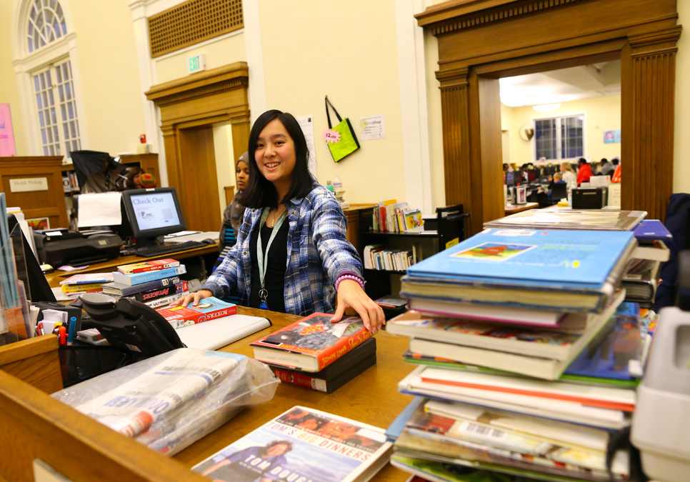 Library staff at service desk area at the Columbia Branch