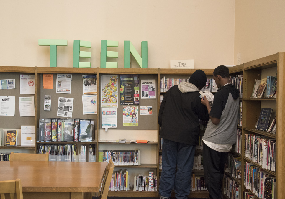 Library patrons in teen area at the Douglass-Truth Branch