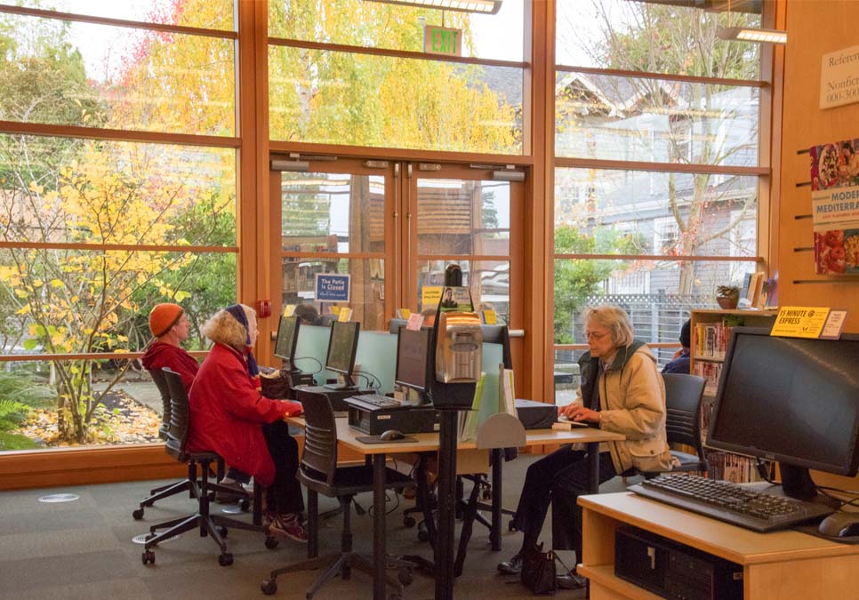 Library patrons using public computers at the Montlake Branch 