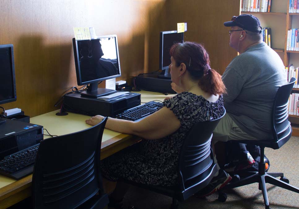 Library patrons using public computers at the University Branch
