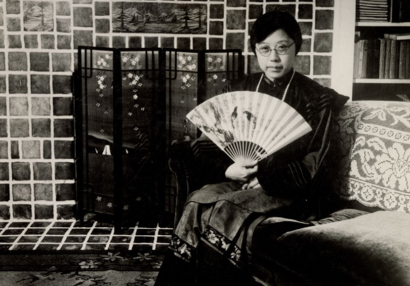 Photo from collection showing a person holding a fan.