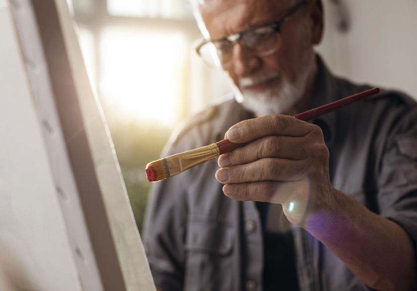 Man painting on a canvas