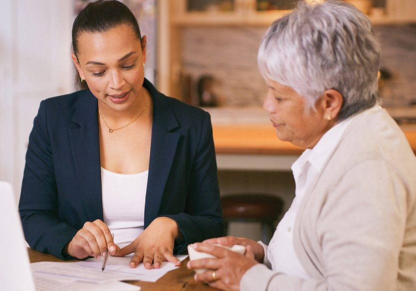 women speaking with senior