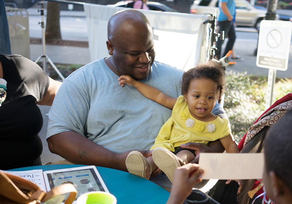 Family at art on the plaza event at the Central Library