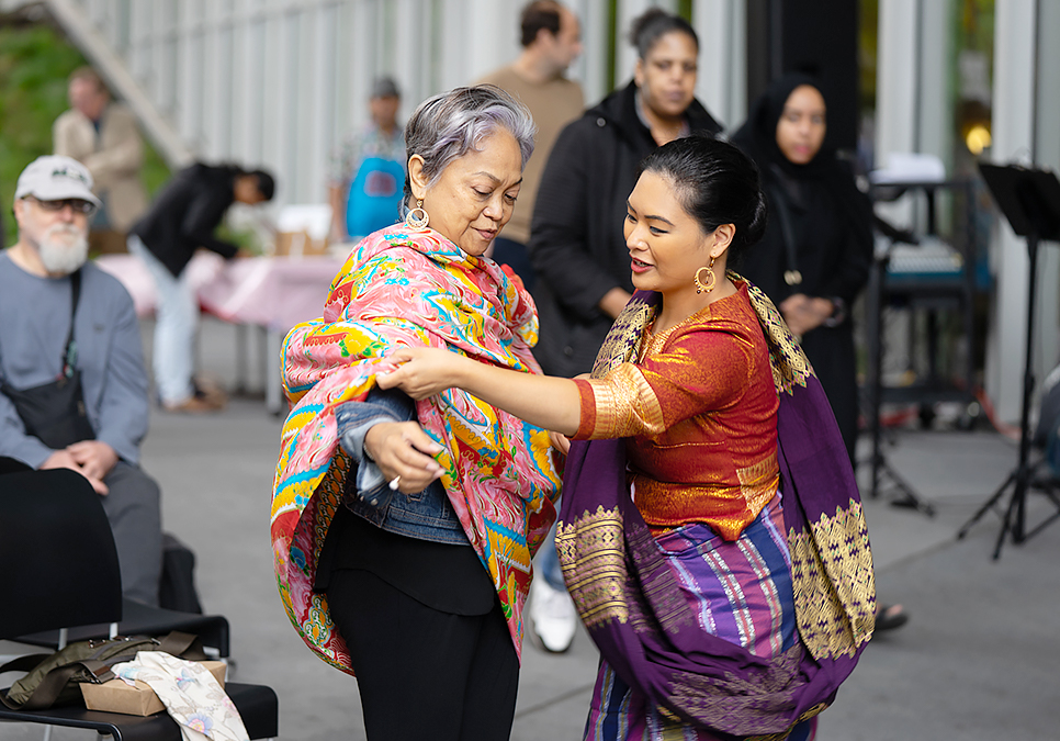 Performer and patron at art on the plaza event at the Central Library