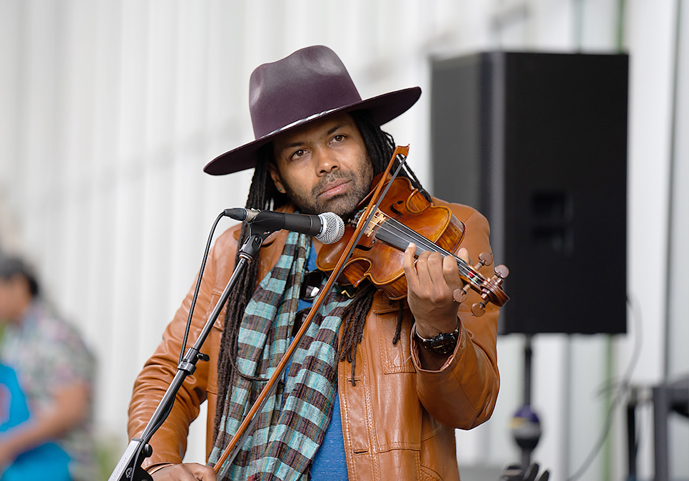 Performer playing the violin at art on the plaza event at the Central Library