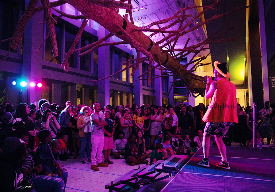 Performer on stage in front of audience at legendary children event at the Seattle Art Museum in 2019