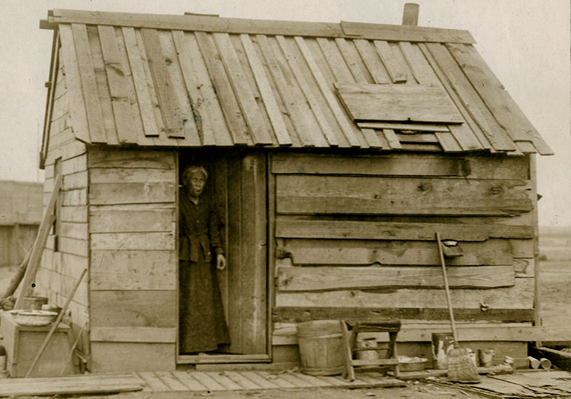 Photo of Ellen Phillips in doorway of her home, Seattle, May 10, 1910