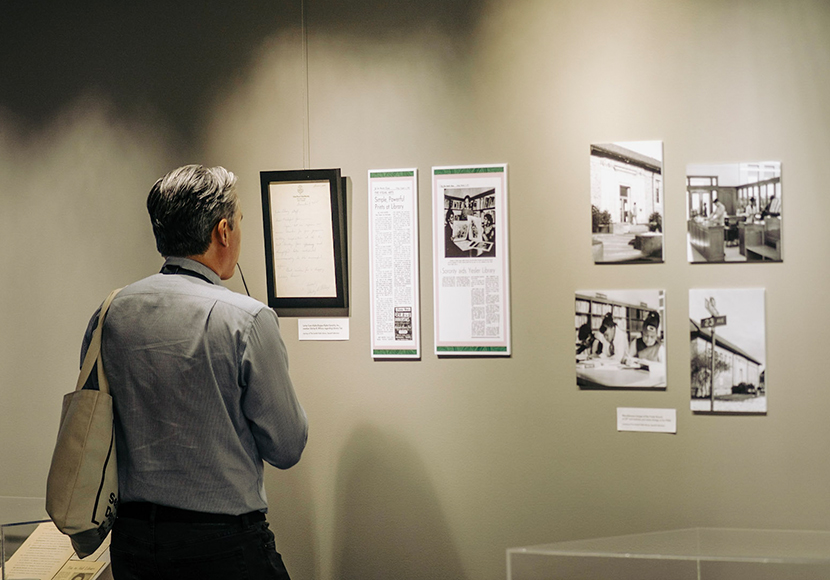 Person looking at exhibit piece.