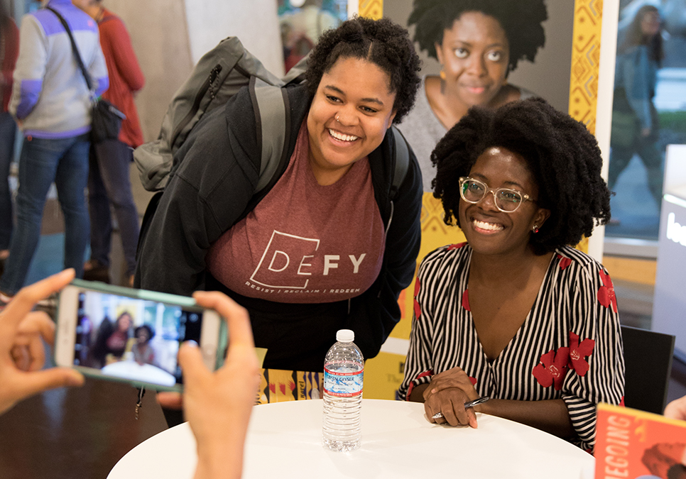 Yaa Gyasi taking photo with guest at Seattle Reads event at the Central Library