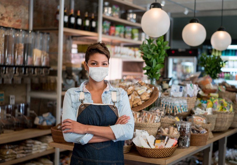 business owner wearing a face covering in her shop