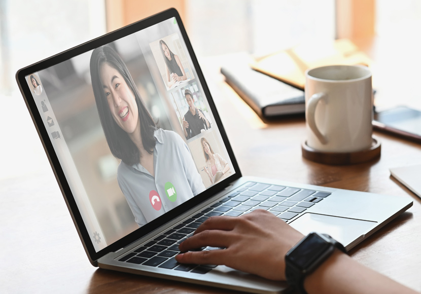 laptop displaying an online meeting 