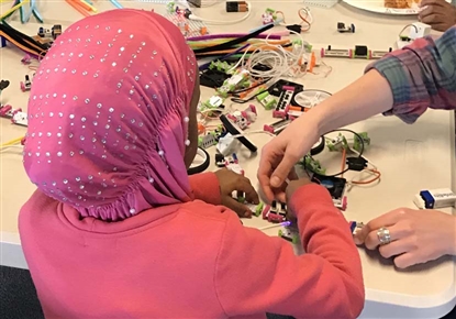 Young patrons working on a craft