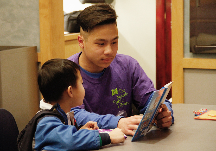 Person tutoring child.