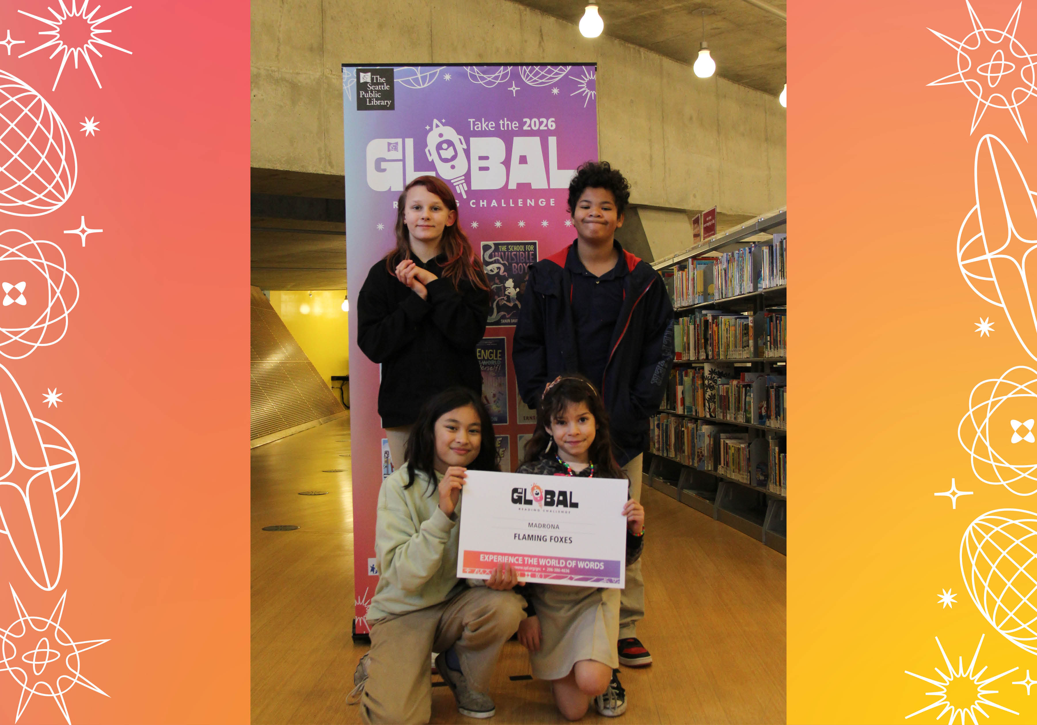 Four members of Madrona's Flaming Foxes posing with sign