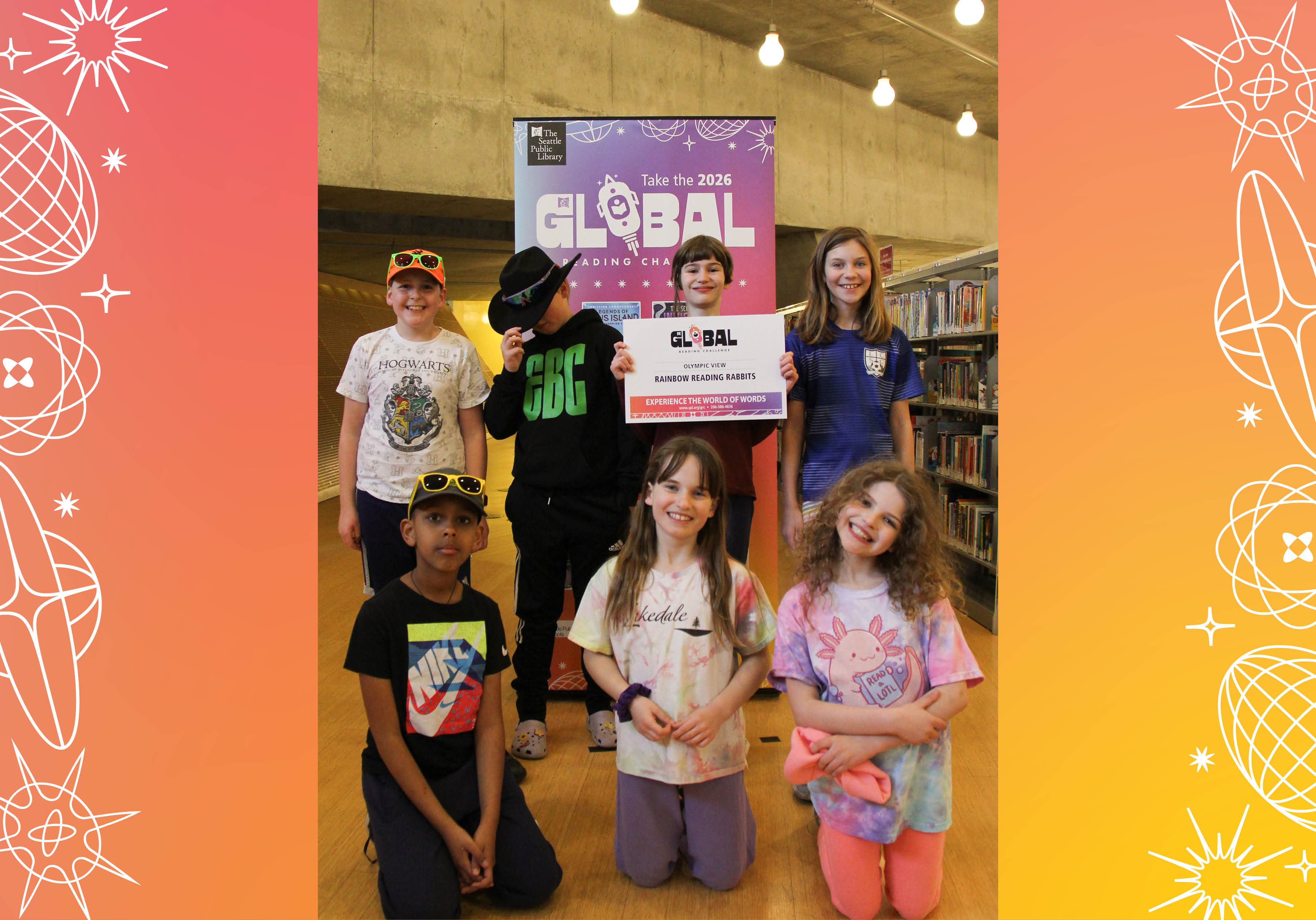 Seven members of Olympic View's Rainbow Reading Rabbits posing with sign