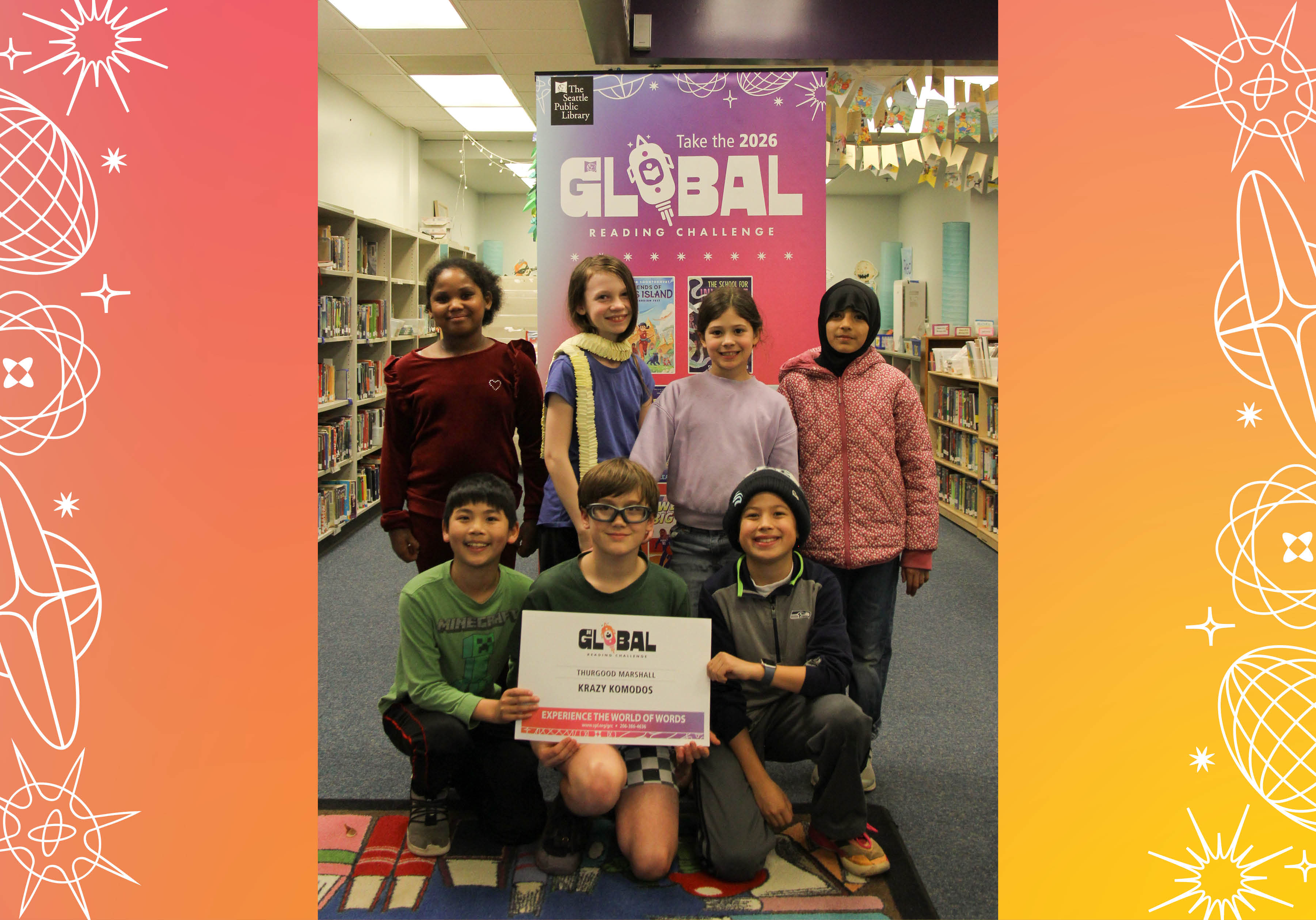 Seven members of Thurgood Marshall's Krazy Komodos posing with sign