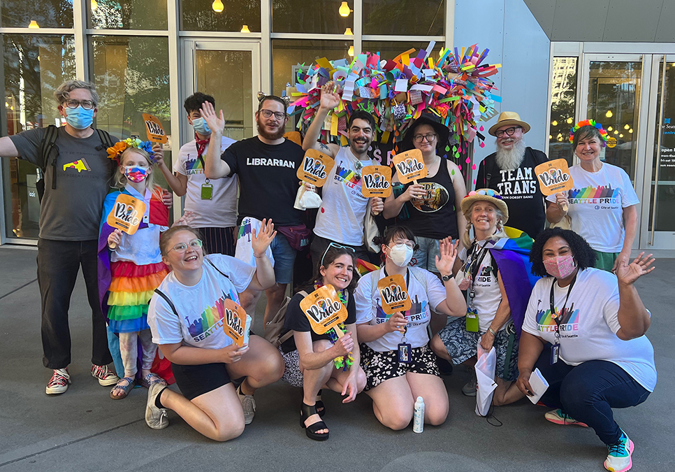 Library staff, friends and family at the Central Library before the Seattle Pride Parade in 2022.
